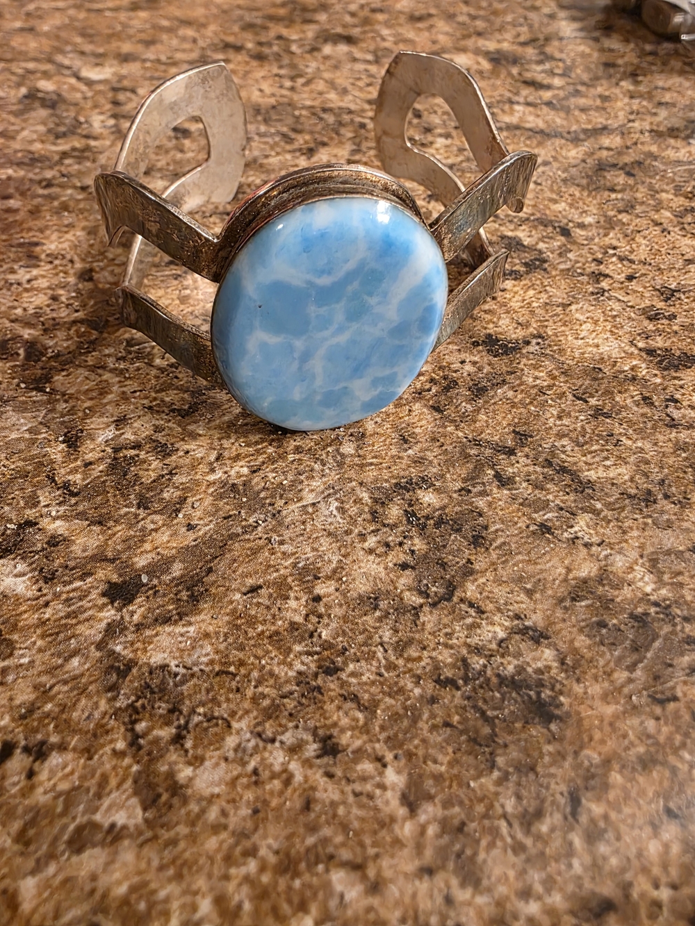 Open work oval larimar stone cuff bracelet crafted from sterling silver